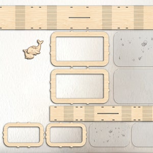 Puede incluir: Un kit de manualidades de madera para construir una caja con tem&aacute;tica de ballenas. El kit incluye piezas de madera precortadas, paneles de acr&iacute;lico transparentes y recortes en forma de ballena. La caja se puede utilizar para almacenamiento o exhibici&oacute;n.
