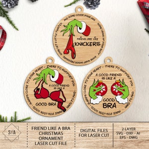 May include: A set of three laser cut wooden Christmas ornaments featuring a green Grinch-like character with the text "A good friend is like a good bra" and "Friend are like knickers".