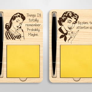 May include: Two wooden notepads with a pen holder and a retro-style illustration of a woman. The notepad on the left says "Things I'll totally remember. Probably. Maybe." The notepad on the right says "Big plans, tiny attention span."