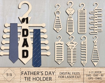 May include: A set of laser cut wooden tie holders for Father's Day. The designs include a tie rack with the word "DAD" and the number "1", a tie rack with the words "Hero Love", a tie rack with the words "Love Dad", and a tie rack with the words "Best Dad Ever".