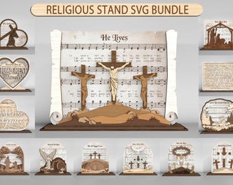 Puede incluir: Una colección de soportes religiosos de madera cortados con láser que presentan varios temas cristianos. La pieza central muestra tres cruces en una colina sobre un fondo de partituras con el texto He Lives. Otros soportes muestran corazones y cruces.