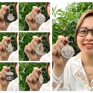May include: A set of six wooden ornaments featuring different designs, including a crescent moon, a crystal, and a floral motif. The ornaments are painted black and white and have a delicate, intricate design.
