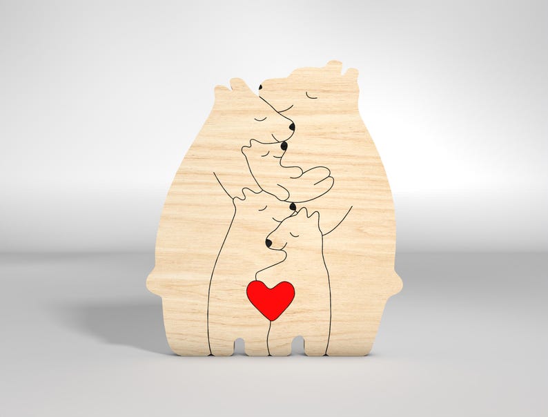 May include: Wooden cutout of a family of four polar bears hugging each other. The bears are outlined in black and the bottom bear has a red heart in its chest.