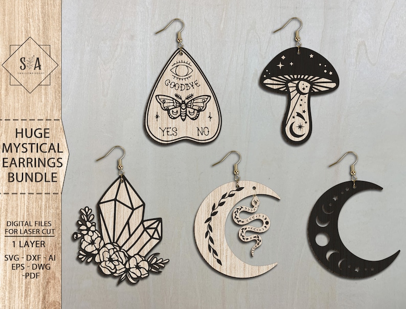 May include: A set of four laser cut wooden earrings featuring mystical designs. The earrings include a crescent moon with a snake, a crystal, a mushroom with stars, and a Ouija board with a butterfly.