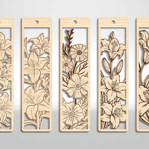 May include: Set of five wooden bookmarks with laser-cut floral designs. Each bookmark features a different flower arrangement, including lilies and daisies, within a rectangular frame. The bookmarks have a natural wood finish and a small hole at the top for a tassel.