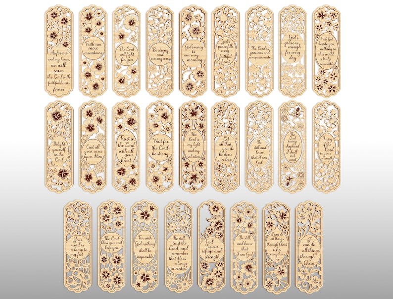 May include: A collection of laser-cut wooden bookmarks with floral designs and inspirational quotes. Each bookmark features intricate cut-out patterns and text in a variety of fonts. The bookmarks are light brown with darker brown accents.