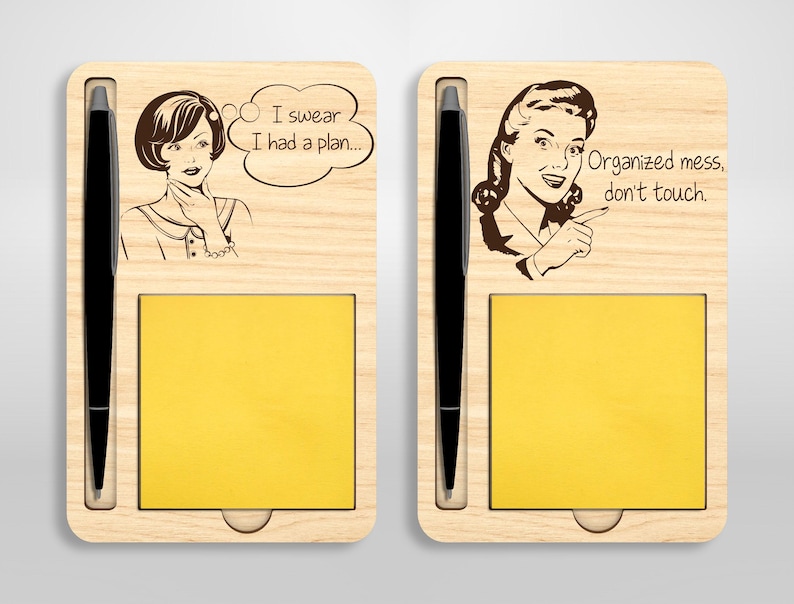 May include: A wooden desk organizer with two compartments, each with a notepad and a pen holder. The left compartment features a retro-style illustration of a woman with the text "I swear I had a plan..." The right compartment features a retro-style illustration of a woman with the text "Organized mess, don't touch."