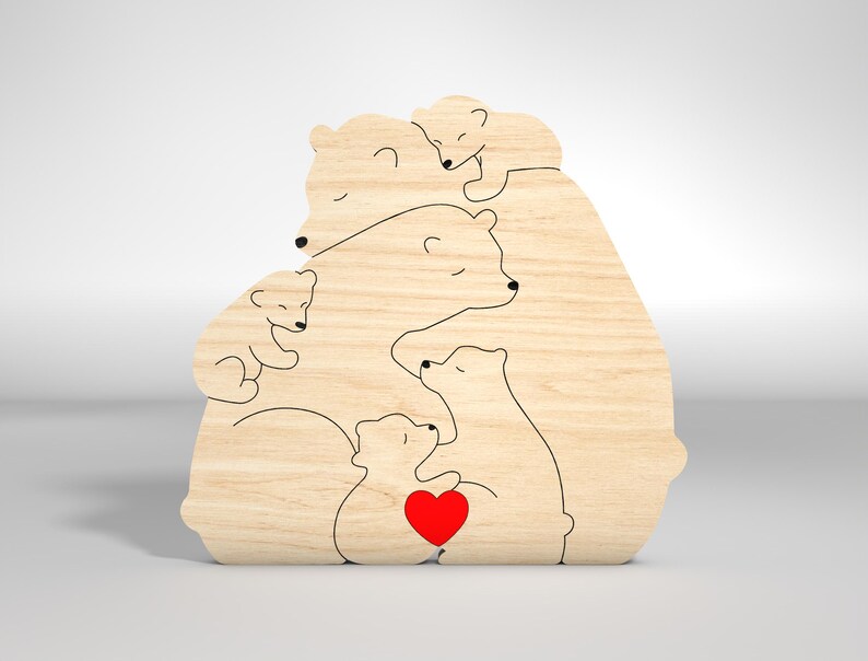 May include: A wooden cutout of a family of polar bears, with a mother bear holding a heart in her paw, surrounded by her cubs. The cutout is made of light brown wood and has a simple, minimalist design.