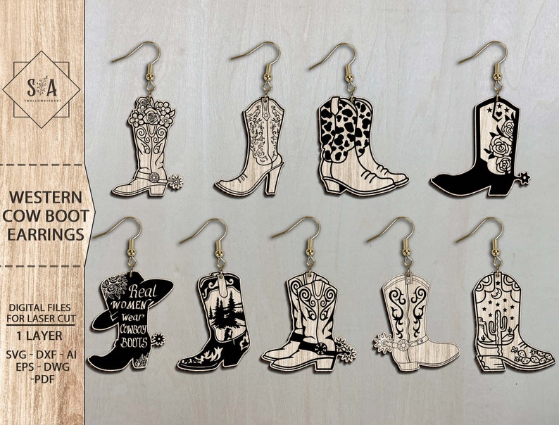 May include: Ten pairs of laser cut wooden cowgirl boot earrings. The boots are decorated with various designs, including floral patterns, cowboy boots, and the text "Real Women Wear Cowboy Boots".