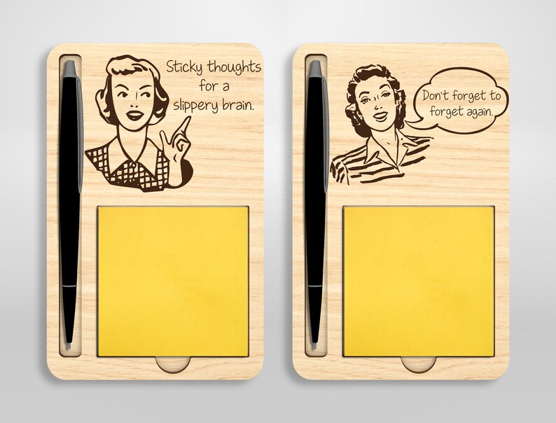 May include: Two wooden notepads with a pen holder and a sticky note pad. The left notepad has the text "Sticky thoughts for a slippery brain." The right notepad has the text "Don't forget to forget again."