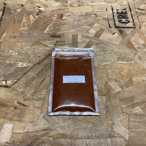 May include: A small silver pouch containing 25 grams of Cypress Umber Warm pigment powder from Powder Emporium.