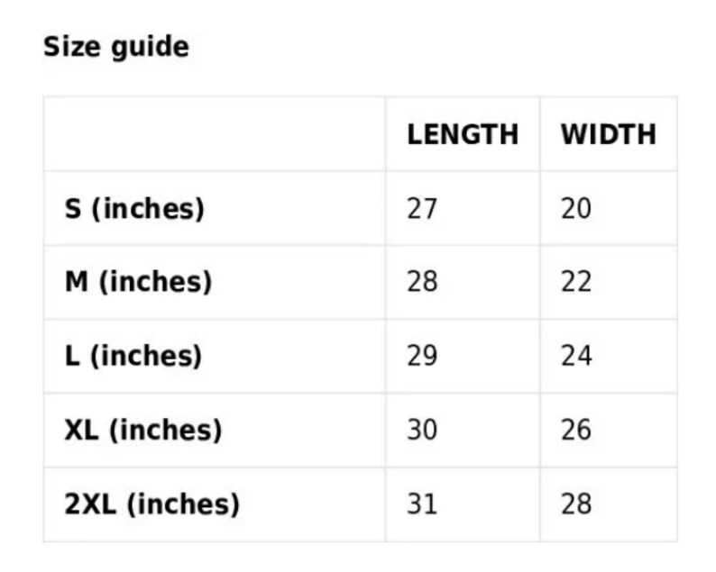 Puede incluir: Gu&iacute;a de tallas para una prenda con medidas en pulgadas. La tabla muestra la longitud y el ancho de la prenda en pulgadas para las tallas S, M, L, XL y 2XL.