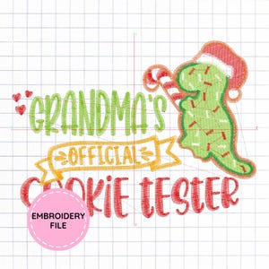 May include: An embroidery design featuring the text "GRANDMA'S OFFICIAL COOKIE TESTER" in green, yellow, and red. A green dinosaur wearing a red and white Santa hat and holding a red and white candy cane is on the right. Three small red hearts are on the left.