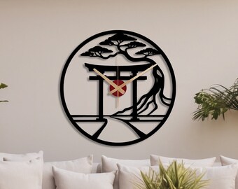 May include: Black and white wall clock with a Japanese-inspired design featuring a torii gate, a tree, and a red circle in the center. The clock is hanging on a white wall.
