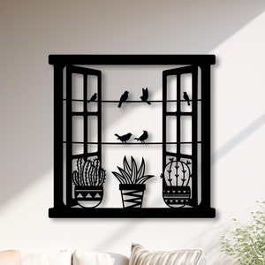 May include: Black metal wall decor featuring a window with open sashes, potted plants, and birds in flight. The window is framed with a black border and has a rustic, farmhouse style.