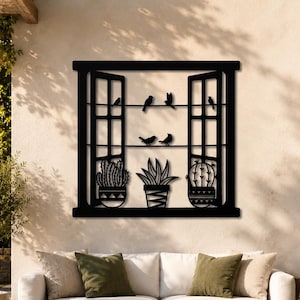 May include: A black metal wall art piece shaped like an open window frame. The design features two horizontal lines with five small bird silhouettes perched on them, and three potted plants sitting on the window sill at the bottom.