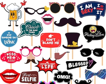 May include: A collection of 25+ photo booth props on sticks, including various glasses, mustaches, lips, hats, and speech bubbles with text such as Cheers to the good times, Don't blame me, Feeling extra, Living my best life, and First selfie.