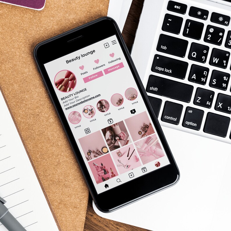 May include: A smartphone displaying a social media profile for a beauty lounge. The profile includes a pink and white color scheme, a logo, a bio, and a grid of nine images. The text on the screen reads "Beauty lounge", "Add Your Bio", "Add Your Description", "www.yourwebsitename.com", and "TITTLE".