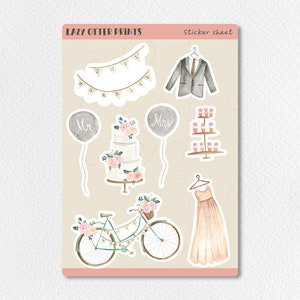 May include: A sticker sheet with watercolor illustrations of wedding-themed elements. Includes a banner that says "Just Married", a suit, a wedding cake, balloons that say "Mr" and "Mrs", cupcakes, a bicycle with flowers, and a wedding dress.