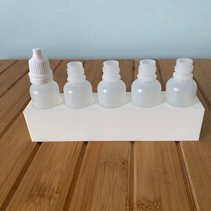Houder voor druppelflesje van 15 ml