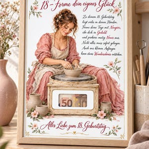 May include: A framed print featuring an illustration of a person working at a pottery wheel, wearing a pink dress and apron. The text reads 18-Forme dein eigenes Glück, Zu deinem 18. Geburtstag, and Alles Liebe zum 18. Geburtstag, with a 50 Euro bill visible.