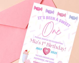 May include: A pink birthday invitation with the text "It's Been a Sweet One" and "Mia's 1st Birthday!" features candy illustrations. Includes date, time, and RSVP information. A pink envelope is in the background.