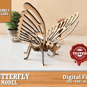 Könnte beinhalten: Ein 3D-Modell aus Holz eines Schmetterlings mit filigranen Details. Das Modell ist zusammengebaut und bereit zum Ausstellen. Das Bild enthält den Text "Assembly Include" und "Dream Design Studios TESTED".
