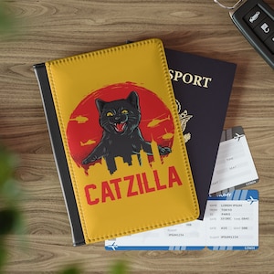 Funda para pasaporte Catzilla, regalo para viajeros, accesorios de viaje, billetera, piel sintética, para amantes de los gatos, porta pasaporte con forma de gato