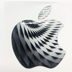 Könnte beinhalten: Ein schwarz-weißer Apple-Logo-Aufkleber mit geometrischem Muster. Der Aufkleber ist glänzend und hat einen 3D-Effekt.