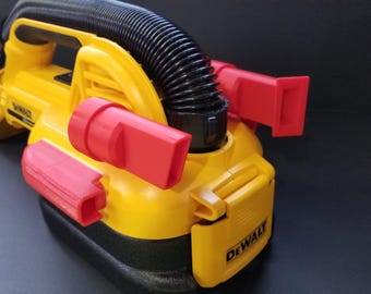 May include: Yellow and black DeWalt vacuum with red nozzle attachments. The vacuum has a black hose and handle. Text on the image reads "VACUUM NOT INCLUDED / ASPIRATEUR NON INCLUE" and "*MUFFLER NOT INCLUDED".