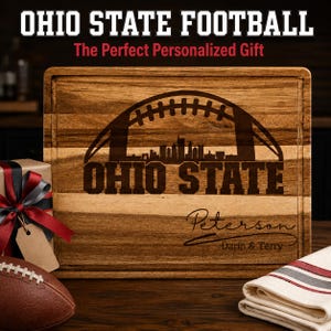 May include: A rectangular wooden cutting board featuring a laser-engraved design of a football arching over a city skyline. The text OHIO STATE is engraved below the skyline, with the name Peterson and Darin & Terry engraved underneath.