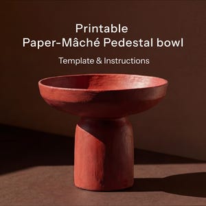 May include: A red-brown paper-mâché pedestal bowl. The bowl has a wide, shallow top and a cylindrical base. Text on the image reads "Printable Paper-Mâché Pedestal bowl Template & Instructions."
