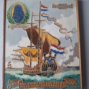 May include: A ceramic tile depicting a sailing ship with Dutch flags and the text "VII PROVINCIEN". The tile includes the text "ADH RUYTER" and "10 JUNI 1666". The artwork is framed in a gold-coloured border. The ship sails on a blue sea.