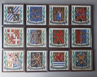 12 cloisonne (coat of arms) tiles Porceleyne Fles of 11 provinces + the Netherlands