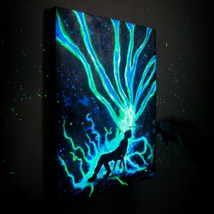 Glow in the dark painting of a man with cosmic energy bursting from his head, psychedelic galaxy wall art