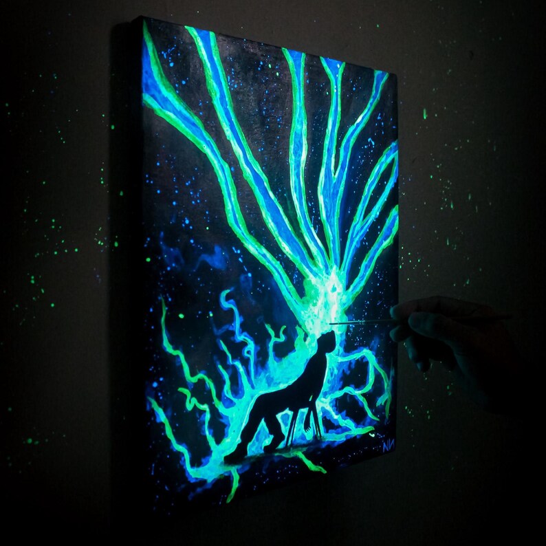 Glow in the dark painting of a man with cosmic energy bursting from his head, psychedelic galaxy wall art