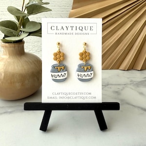 May include: A rustic wooden sign with the text "Welcome to our home" in white lettering. The sign features a distressed finish and a simple, inviting design, perfect for front door decor.