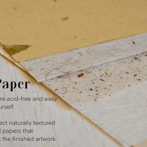 May include: Close-up of a stack of textured papers. The papers are acid-free and easy to frame. The text "The Paper" is visible at the top of the image.  The text below reads: "All papers are acid-free and easy to frame yourself. I always select naturally textured and colored papers that compliment the finished artwork."