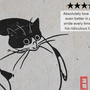 May include: Black and white line art print of a cat with a surprised expression. The cat is looking to the right and has a long tail.