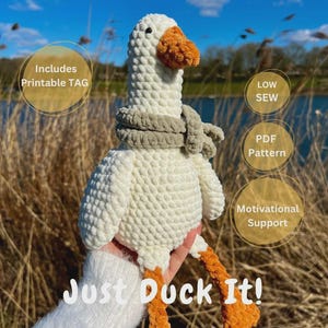 Puede incluir: Un ganso blanco de peluche hecho a mano con pico y patas naranjas, que lleva una bufanda gris. El texto "Just Duck It!" es visible. La imagen también incluye el texto "Includes Printable TAG", "LOW SEW", "PDF Pattern" y "Motivational Support".