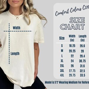 May include: A cream-colored t-shirt with a size chart, labeled "Comfort Colors C1717." The chart displays measurements in inches for width and length, ranging from size small to 4XL. The model is wearing a medium for reference.