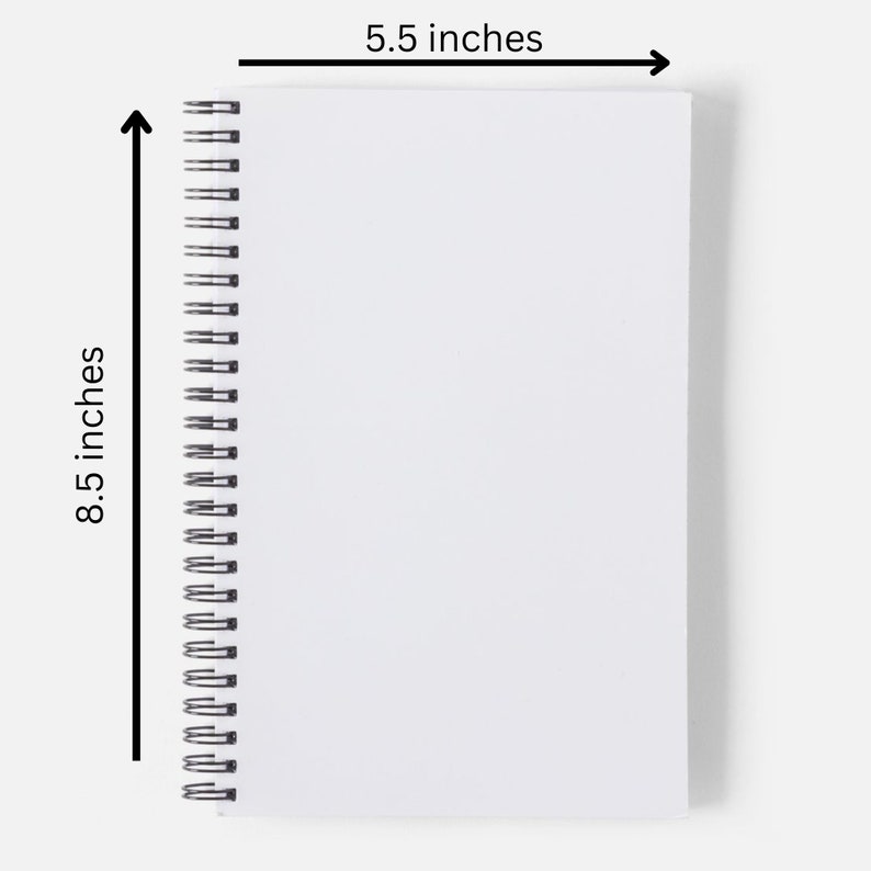 May include: A white spiral bound notebook with a white cover. The notebook measures 8.5 inches by 5.5 inches.