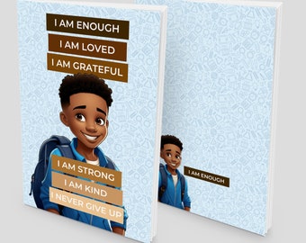 May include: Two blue and white notebooks with a cartoon illustration of a young boy on the front cover. The notebook on the left has the text "I am enough, I am loved, I am grateful, I am strong, I am kind, I never give up." The notebook on the right has the text "I am enough".