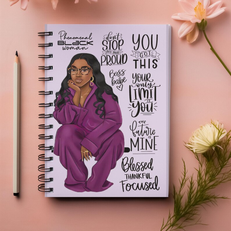 May include: A spiral bound notebook with a purple illustration of a woman with a quote that says "Phenomenal Black Woman" and other inspirational quotes including "Don't Stop Until You're Proud", "You Got This", "Boss Babe", "Your Only Limit Is You", "The Future Is Mine", "Blessed Thankful Focused".