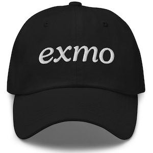 May include: Black baseball cap with white embroidered text that reads "exmo".