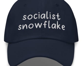 May include: A navy blue baseball cap with white embroidered text that reads "socialist snowflake".