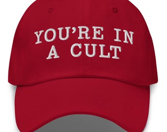 May include: Red baseball cap with white embroidered text that reads "You're in a cult".