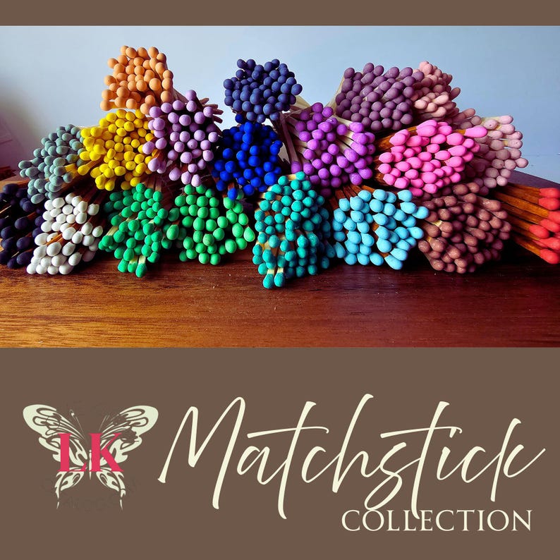 May include: A collection of colorful matchsticks arranged in a semi-circle on a wooden surface. The matchsticks are in various shades of blue, green, purple, pink, yellow, orange, and brown. The text "Matchstick Collection" is visible at the bottom of the image.