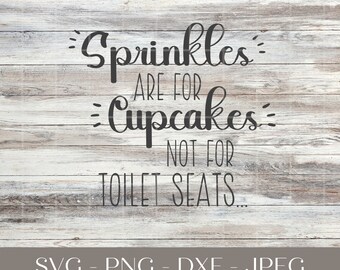 May include: A woodgrain background with a black and white graphic that reads "Sprinkles are for Cupcakes, not for Toilet Seats."