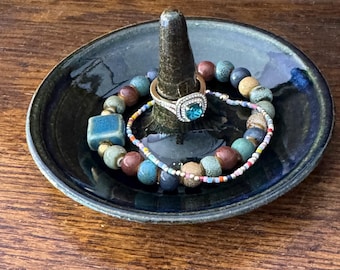Ring holder. Ring dish. Handmade, hand glazed. Microwave and dishwasher safe. Blue/green glaze over brown clay.   Artist signed